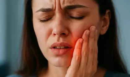 Болит зуб под коронкой: что делать?